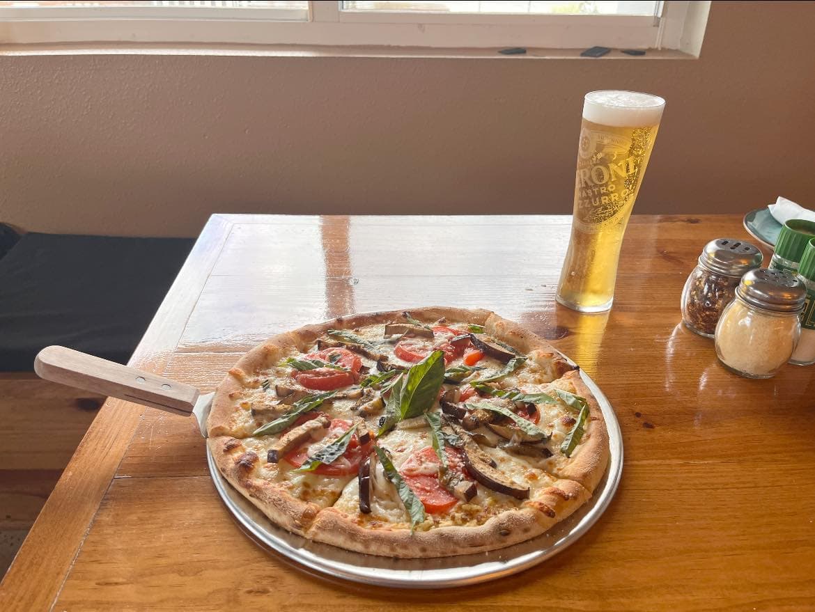 Giuseppe's Ristorante & Pizzeria wood-fired pizza with Peroni
